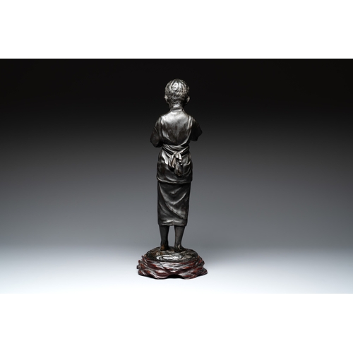 481 - A Japanese bronze sculpture of a boy feeding a bird on a wooden stand, signed, Meiji, 19th C.H.: 61,... 