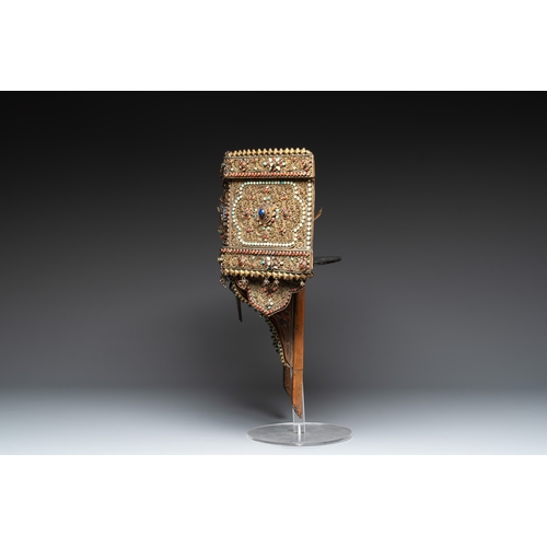 494 - A Nepalese gilt copper console inlaid with glass, precious stones and red coral, 19th C.Dim.: 47 x 1... 