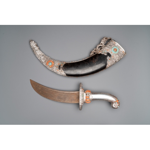 496 - A large Tibetan coral- and turquoise-inlaid silver dagger, 19th C.L.: 70,5 cm