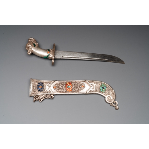 497 - A large Tibetan coral- and precious stone-inlaid silver dagger, 19th C.L.: 50,5 cm