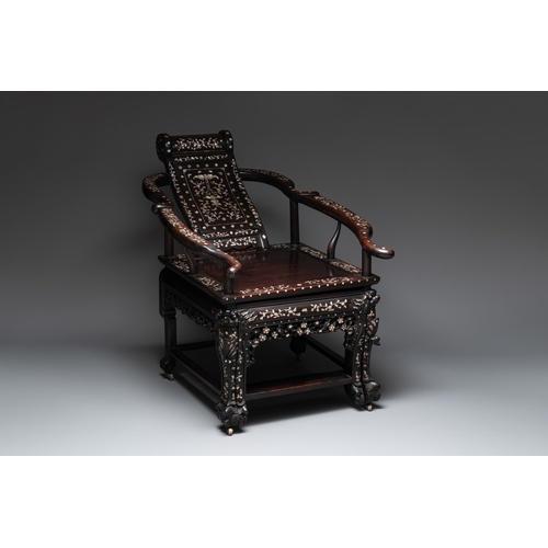 548 - A Chinese mother-of-pearl-inlaid hongmu reclining armchair and retractable footrest, Canton, 19th C.... 