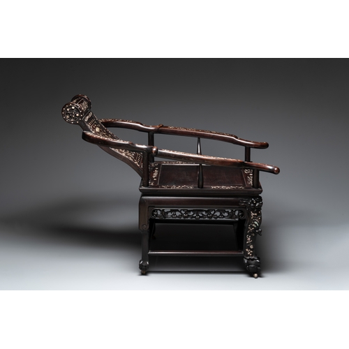 548 - A Chinese mother-of-pearl-inlaid hongmu reclining armchair and retractable footrest, Canton, 19th C.... 