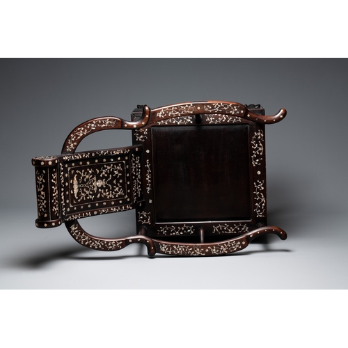 548 - A Chinese mother-of-pearl-inlaid hongmu reclining armchair and retractable footrest, Canton, 19th C.... 