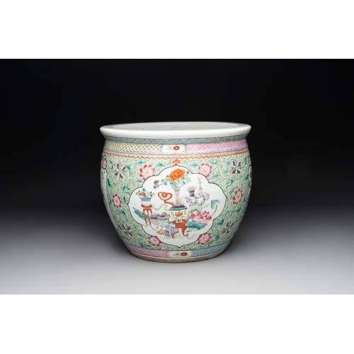 560 - A Chinese famille rose lime-green-ground jardiniÃ¨re with birds, flowers and antiquities, 19th C.Dia... 