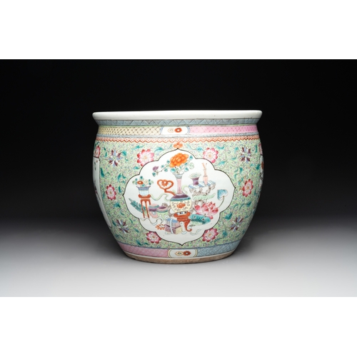 560 - A Chinese famille rose lime-green-ground jardiniÃ¨re with birds, flowers and antiquities, 19th C.Dia... 