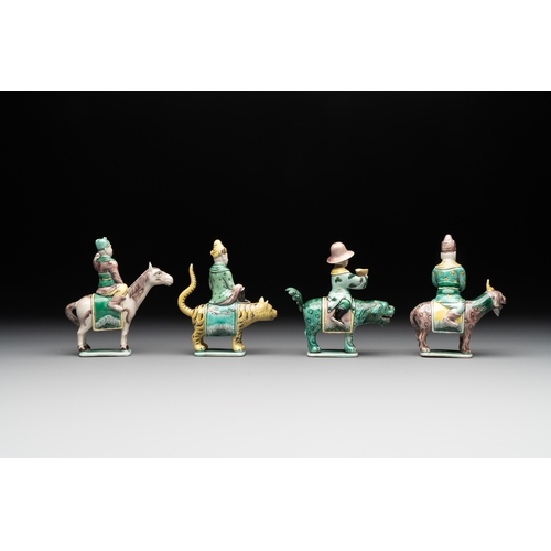 578 - Eight Chinese verte biscuit figures riding mythical animals, 19/20th C.Dim.: 8,8 x 4,8 x 12 cm (the ... 