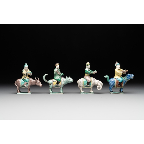 578 - Eight Chinese verte biscuit figures riding mythical animals, 19/20th C.Dim.: 8,8 x 4,8 x 12 cm (the ... 