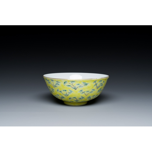 68 - A Chinese blue and white bowl with floral design and a famille verte yellow-ground 'bamboo' bowl, To... 