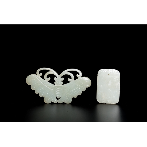 720 - Four Chinese white, celadon and russet jade pendants, Qing/RepublicDim.: 10,5 x 5,5 x 0,5 cm (the bu... 