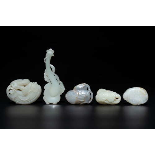 725 - Five Chinese white, celadon and russet jade carvings of three melons, a lotus pod and a lingzhi, 19t... 