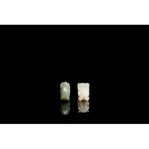 736 - Two Chinese white and celadon jade belt hooks, QingL.: 13,5 cm (the largest) L.: 12 cm (the smallest... 