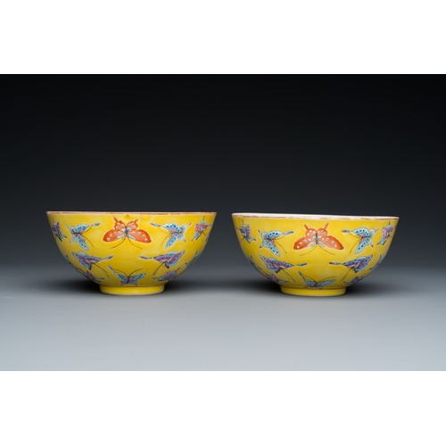 75 - A pair of Chinese famille rose yellow-ground 'butterfly' bowls, Tongzhi mark, 20th C.Dia.: 14 cm - H... 