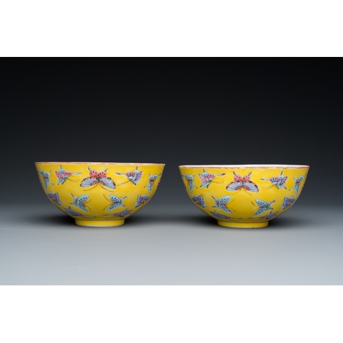 75 - A pair of Chinese famille rose yellow-ground 'butterfly' bowls, Tongzhi mark, 20th C.Dia.: 14 cm - H... 