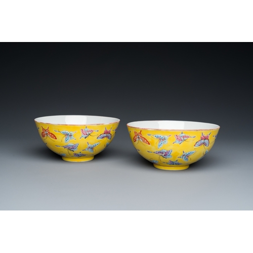 75 - A pair of Chinese famille rose yellow-ground 'butterfly' bowls, Tongzhi mark, 20th C.Dia.: 14 cm - H... 