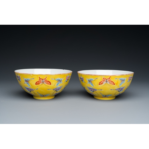 75 - A pair of Chinese famille rose yellow-ground 'butterfly' bowls, Tongzhi mark, 20th C.Dia.: 14 cm - H... 