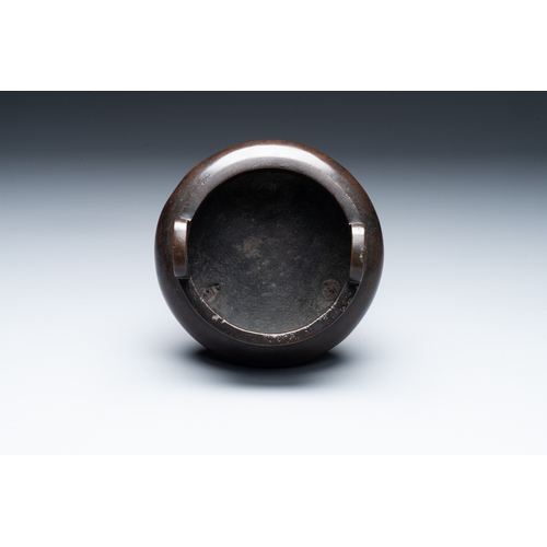 806 - A Chinese bronze two-handled tripod censer, Ding mark, Yuan/MingDia.: 14 cm - H.: 11,5 cm   Weight: ... 