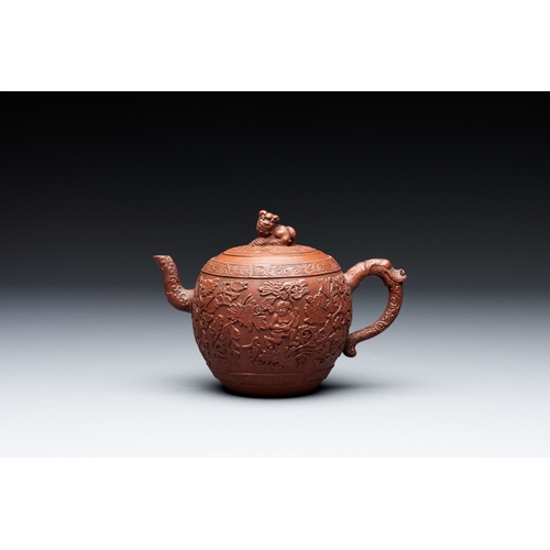 815 - A Chinese Yixing stoneware teapot with boys among flower scrolls, KangxiL.: 15,5 cm - H.: 11 cm (inc... 