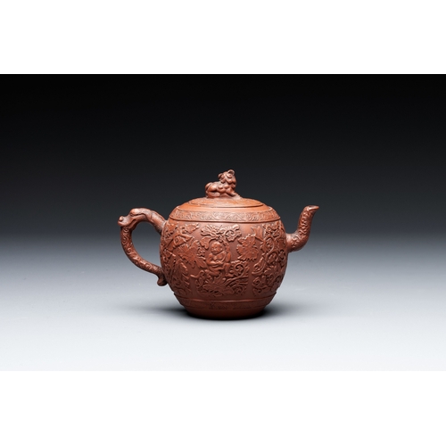 815 - A Chinese Yixing stoneware teapot with boys among flower scrolls, KangxiL.: 15,5 cm - H.: 11 cm (inc... 