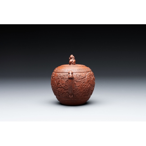 815 - A Chinese Yixing stoneware teapot with boys among flower scrolls, KangxiL.: 15,5 cm - H.: 11 cm (inc... 