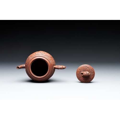 815 - A Chinese Yixing stoneware teapot with boys among flower scrolls, KangxiL.: 15,5 cm - H.: 11 cm (inc... 