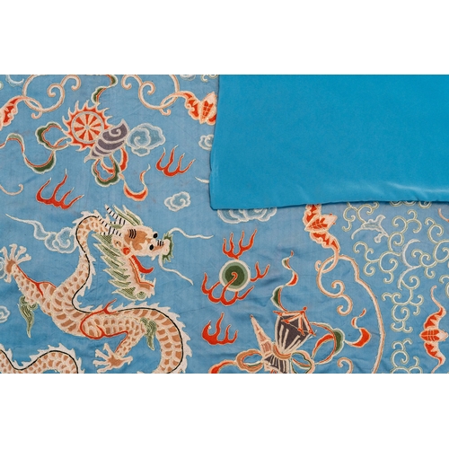 818 - A Chinese blue-ground embroidered silk panel with a dragon among bajixiang, 19th C.Dim.: 214,5 x 214... 