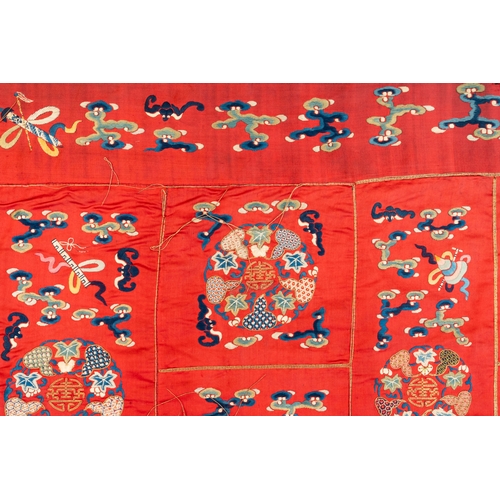 819 - A Chinese red-ground embroidered silk 'bajixiang' panel, Tie Shan Si mark, 19th C.Dim.: 253 x 122 cm... 