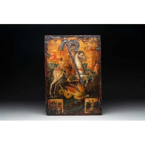 863 - A silver-adorned icon of St. George slaying the dragon, Greece, probably 17th C.Dim.: 38 x 27 cm 
Pr... 