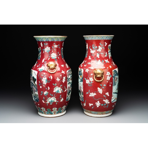 88 - Two Chinese famille rose ruby-ground 'landscape' vases, 19th C.H.: 36 cm