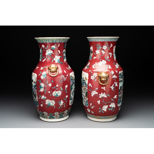 88 - Two Chinese famille rose ruby-ground 'landscape' vases, 19th C.H.: 36 cm