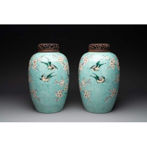 89 - A pair of fine Chinese famille verte turquoise-ground 'magpie and prunus' jars with reticulated wood... 