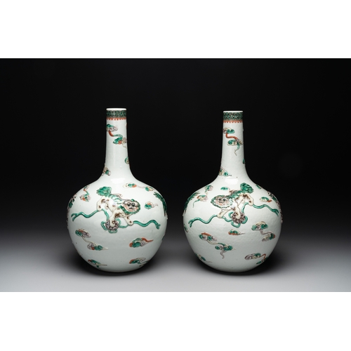 92 - A pair of Chinese famille verte relief-decorated 'animals' vases, 19th C.H.: 41,7 cm (the tallest) H... 