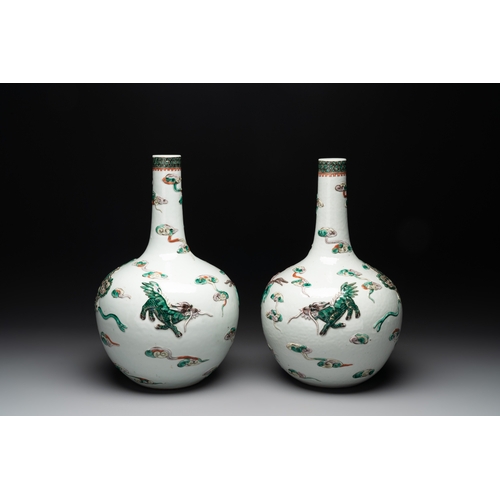 92 - A pair of Chinese famille verte relief-decorated 'animals' vases, 19th C.H.: 41,7 cm (the tallest) H... 