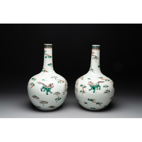 92 - A pair of Chinese famille verte relief-decorated 'animals' vases, 19th C.H.: 41,7 cm (the tallest) H... 