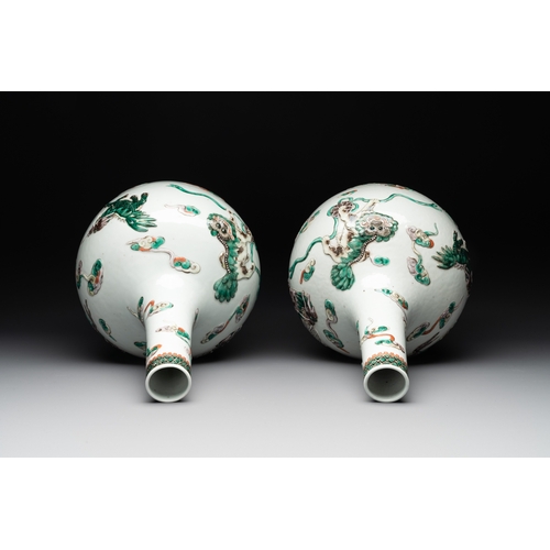 92 - A pair of Chinese famille verte relief-decorated 'animals' vases, 19th C.H.: 41,7 cm (the tallest) H... 