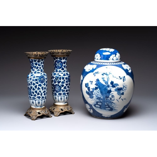 14 - A pair of Chinese blue and white bronze-mounted vases and a covered jar, 19th C.H.: 34,5 cm (the jar... 