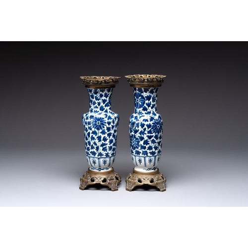 14 - A pair of Chinese blue and white bronze-mounted vases and a covered jar, 19th C.H.: 34,5 cm (the jar... 