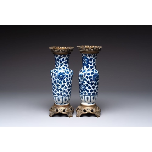 14 - A pair of Chinese blue and white bronze-mounted vases and a covered jar, 19th C.H.: 34,5 cm (the jar... 