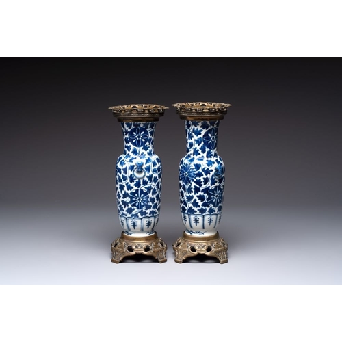 14 - A pair of Chinese blue and white bronze-mounted vases and a covered jar, 19th C.H.: 34,5 cm (the jar... 