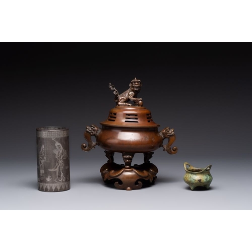 143 - A Chinese bronze tripod censer with cover and stand, a small tripod censer and a silver-inlaid iron ... 