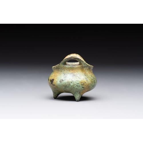 143 - A Chinese bronze tripod censer with cover and stand, a small tripod censer and a silver-inlaid iron ... 