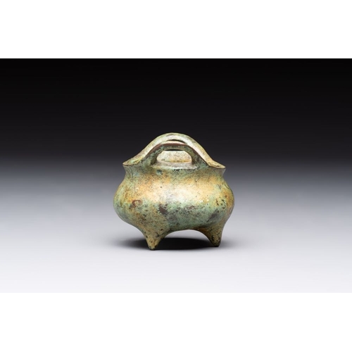 143 - A Chinese bronze tripod censer with cover and stand, a small tripod censer and a silver-inlaid iron ... 