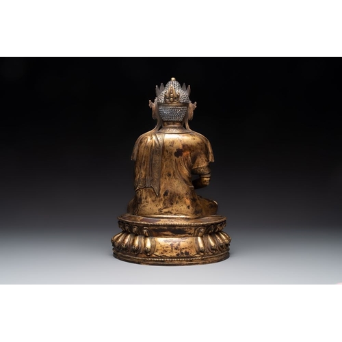 153 - A large Sino-Tibetan gilt bronze Buddha, Xuande mark, possibly MingH.: 39 cm
 Weight: 8530 grams... 