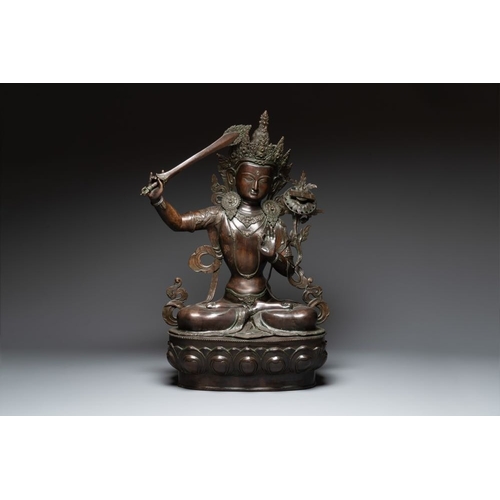 156 - A very large Nepalese bronze sculpture of Manjusri, 19/20th C.H.: 100,5 cm
 Weight: 15,6 kilograms... 