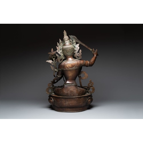 156 - A very large Nepalese bronze sculpture of Manjusri, 19/20th C.H.: 100,5 cm
 Weight: 15,6 kilograms... 