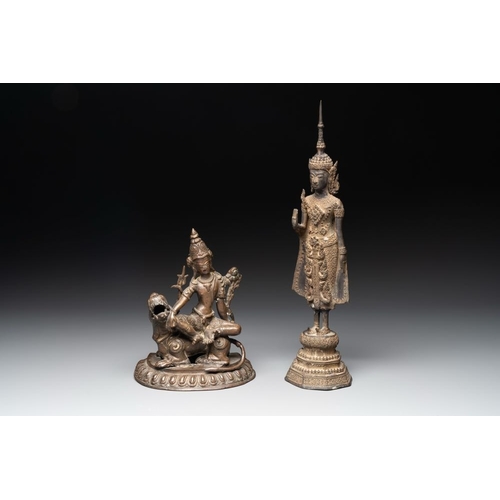 159 - A bronze Simhanada Lokeshvara seated on a Buddhist lion and a Buddha, Southeast Asia, 19th C.H.: 39 ... 