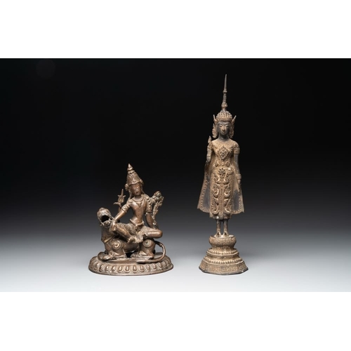 159 - A bronze Simhanada Lokeshvara seated on a Buddhist lion and a Buddha, Southeast Asia, 19th C.H.: 39 ... 