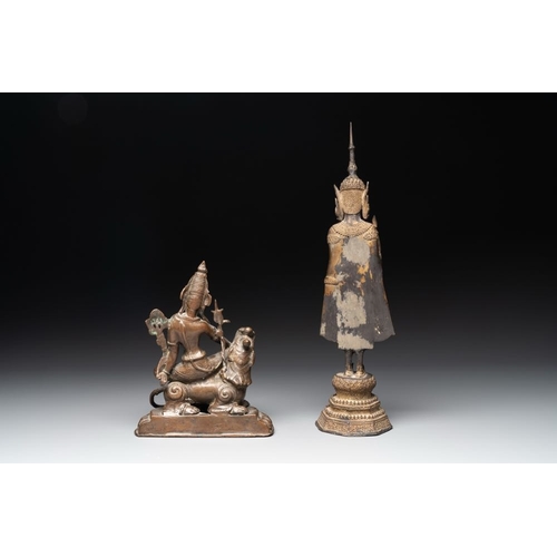 159 - A bronze Simhanada Lokeshvara seated on a Buddhist lion and a Buddha, Southeast Asia, 19th C.H.: 39 ... 