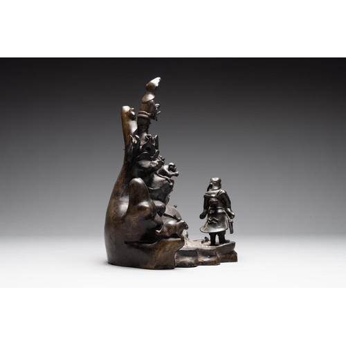 160 - A rare Chinese bronze group depicting two immortals and various animals in a mountainous landscape, ... 