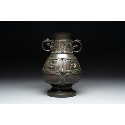 165 - A Chinese archaistic gold- and silver-inlaid bronze vase with pseudo-rust patina, 19th C.H.: 26 cm
 ... 