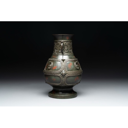 165 - A Chinese archaistic gold- and silver-inlaid bronze vase with pseudo-rust patina, 19th C.H.: 26 cm
 ... 